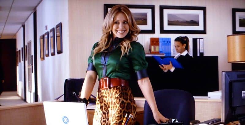 A woman colorfully dressed for the office in this image from ABC Family Original Productions