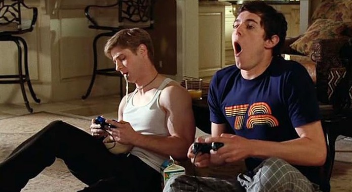 Two people play video games in this image from Warner Bros. Studios