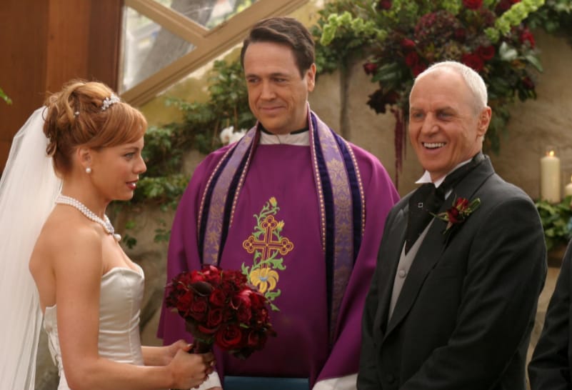 A woman and a man stand at a wedding altar in this image from Warner Bros. Studios 