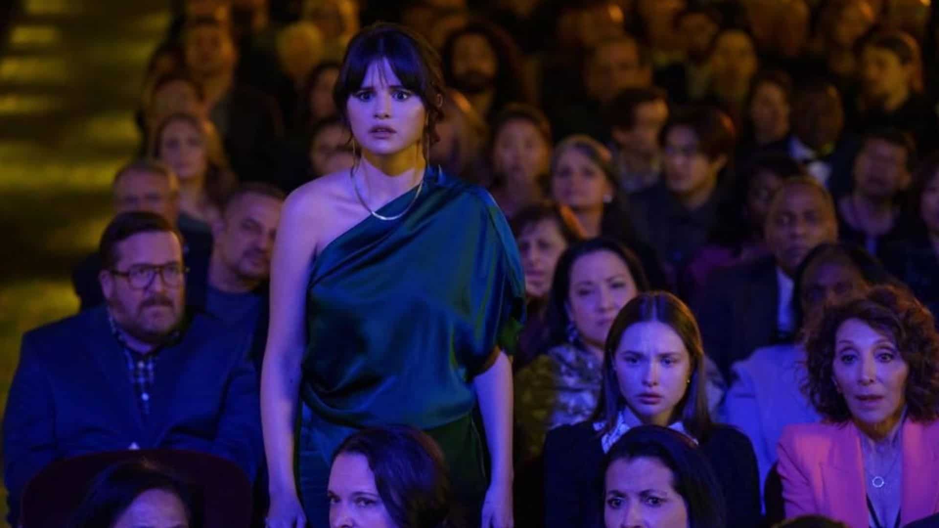 Selena Gomez stands, shocked, in a theater in this image from 20th Television