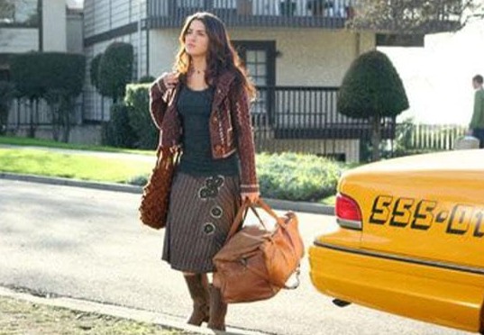 A woman exits a taxi in this image from Warner Bros. Studios