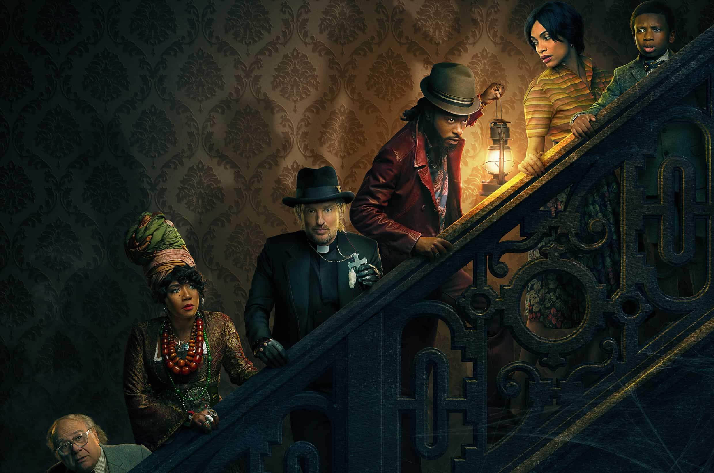 Promo image of the cast on the stairs in this image from Disney