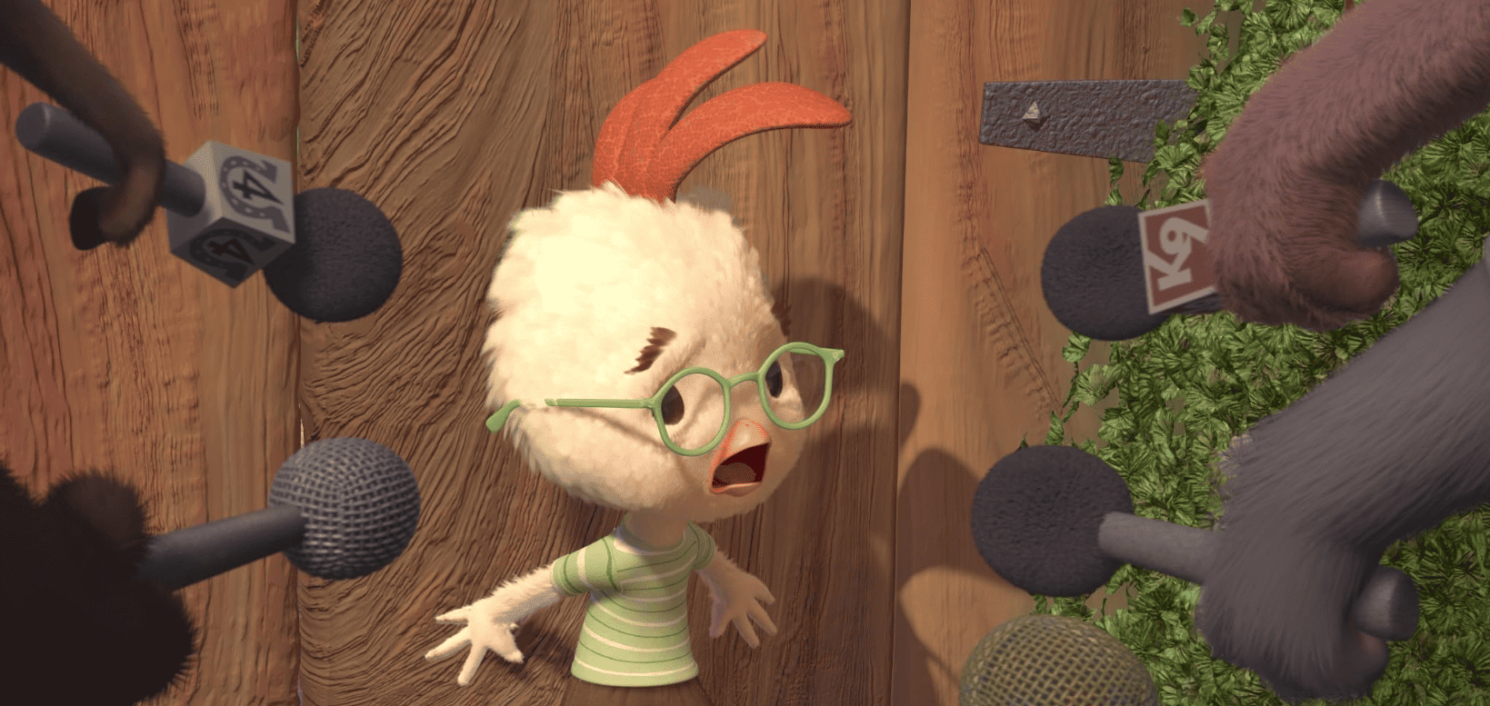 Chicken Little with a worried look on his face in front of reporters in this image from Walt Disney Animation Studios
