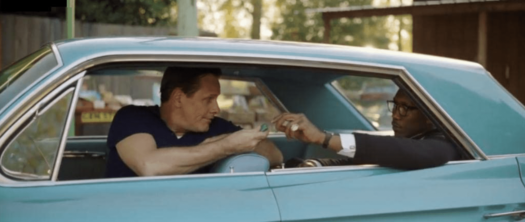 Viggo Mortensen and Mahershala Ali sit in a car