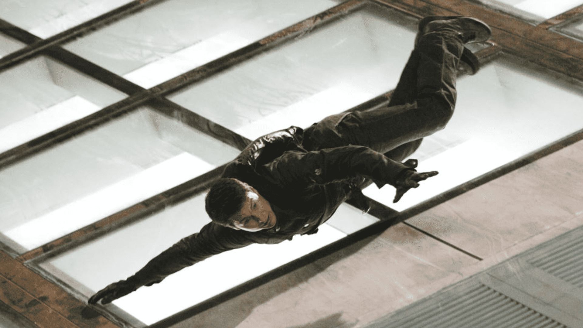 Tom Cruise slides down the slanted rooftop of a skyscraper in this image from Paramount Pictures.