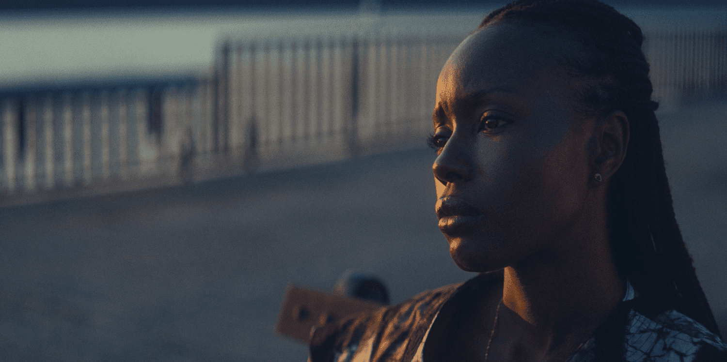 Aisha looking sad on a boardwalk