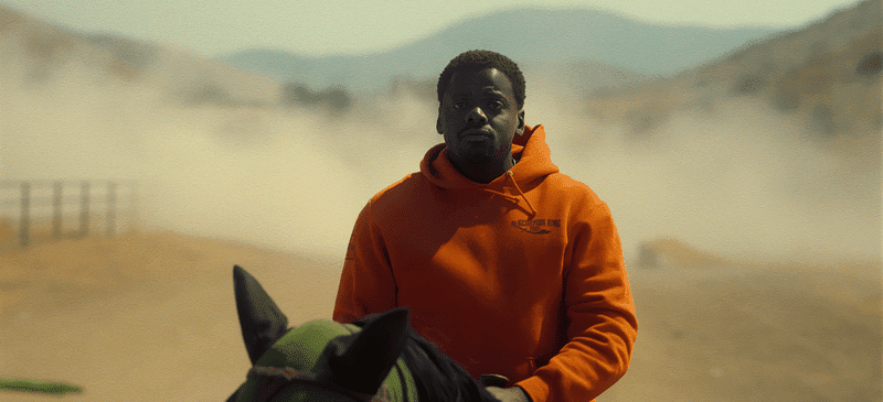 OJ Haywood riding a horse in a dust storm